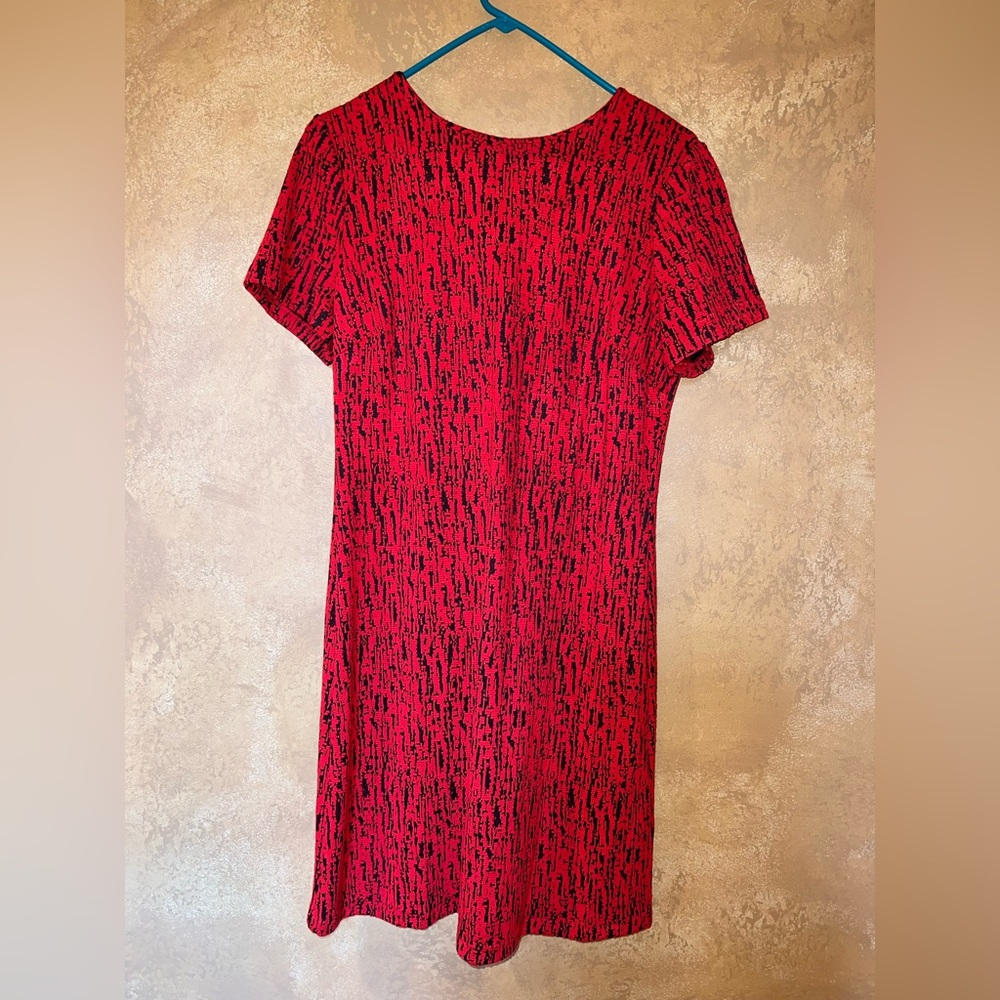 Red with a black pattern dress.